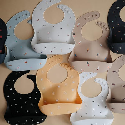 mushie Silicone Baby Bib Adjustable Fit Waterproof Bibs (Numbers Black)